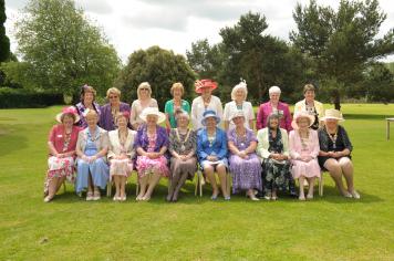 Presidents from all over District 12 sitting with District Chairman Elizabeth and Association President Phyllis Charter